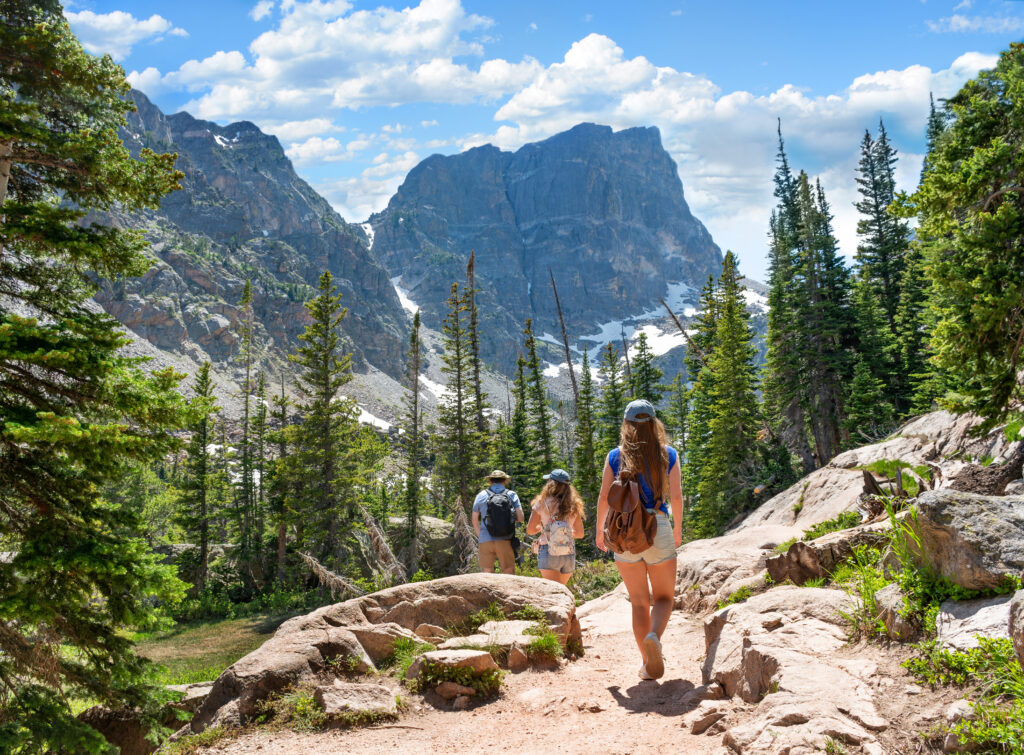 Young adults hiking in mountains